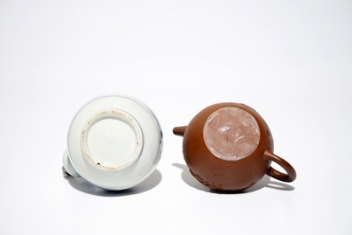 A Chinese Yixing stoneware teapot, two blue and white plates and a silver-mounted kendi, Kangxi/Qianlong