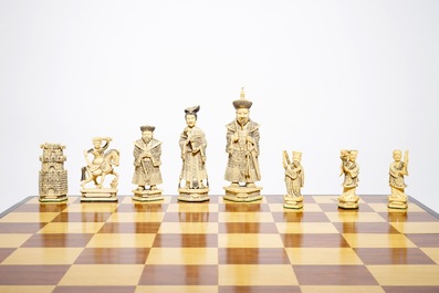 A large Chinese carved ivory chess set with board, 2nd quarter 20th C.