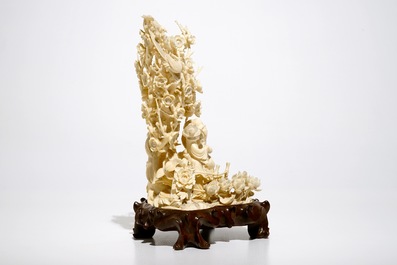 A Chinese carved ivory group of playing children, 2nd quarter 20th C.