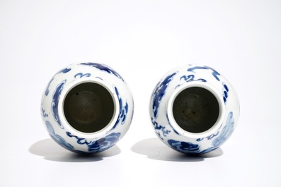 A pair of Chinese blue and white vases with Buddhist lions, Kangxi mark, 19th C.