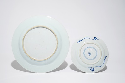 A Chinese Yixing stoneware teapot, two blue and white plates and a silver-mounted kendi, Kangxi/Qianlong