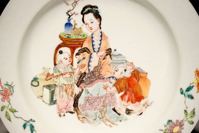 A Chinese famille rose ruby back eggshell plate with a lady and playing boys, Yongzheng