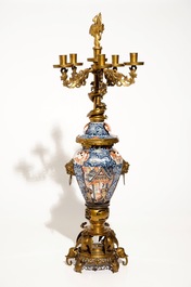A large brass and gilt bronze-mounted Japanese Imari vase and cover candelabra, 19th C.