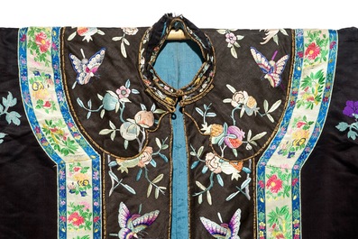 A Chinese embroidered silk woman's robe with butterflies and fruits, Qing