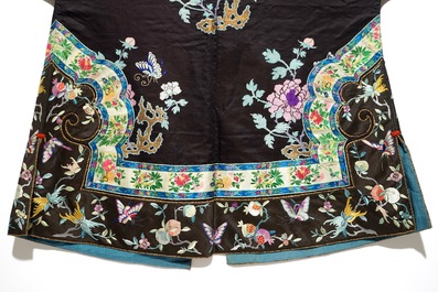 A Chinese embroidered silk woman's robe with butterflies and fruits, Qing