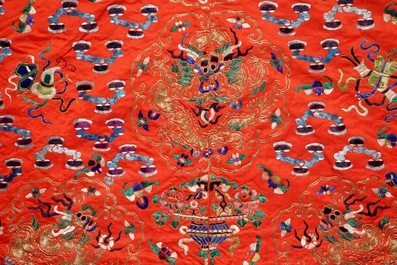 A Chinese embroidered red silk robe, Qing