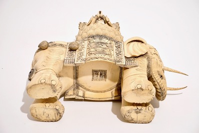 A large Chinese ivory group of Guanyin seated on an elephant, late 19th C.