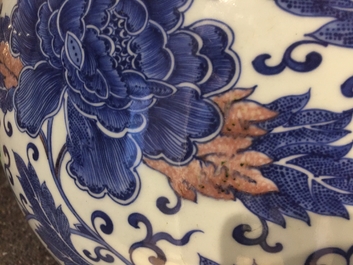 A Chinese copper-red and underglaze blue peony scroll hu vase, Qianlong mark, 19th C.