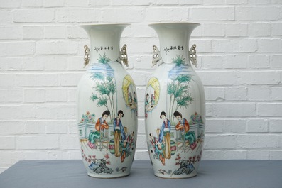 A pair of tall Chinese famille rose vases with figural design and calligraphy, 19/20th C.