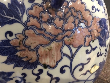 A Chinese copper-red and underglaze blue peony scroll hu vase, Qianlong mark, 19th C.