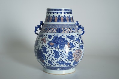 A Chinese copper-red and underglaze blue peony scroll hu vase, Qianlong mark, 19th C.