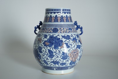 A Chinese copper-red and underglaze blue peony scroll hu vase, Qianlong mark, 19th C.