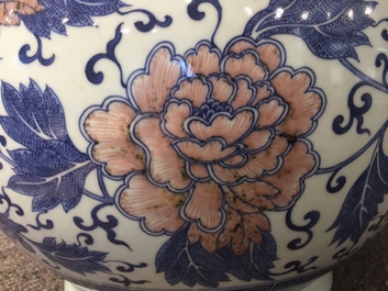 A Chinese copper-red and underglaze blue peony scroll hu vase, Qianlong mark, 19th C.
