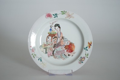 A Chinese famille rose ruby back eggshell plate with a lady and playing boys, Yongzheng