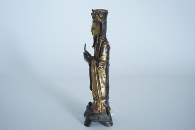 Een Chinese deels vergulde en polychrome bronzen figuur van Wenchang Dijun, Ming