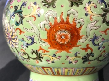 A Chinese famille rose on lime green-ground vase, Qianlong mark, 20th C.
