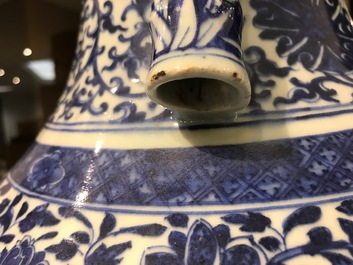 A Chinese blue and white lotus scroll hu vase, Qianlong mark, 19th C.