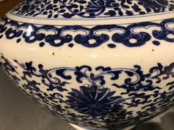 A Chinese blue and white lotus scroll hu vase, Qianlong mark, 19th C.