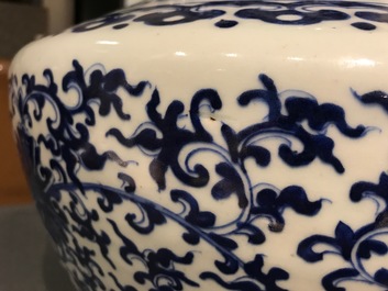 A Chinese blue and white lotus scroll hu vase, Qianlong mark, 19th C.