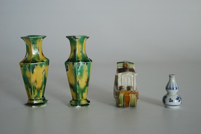 A pair of spinach and egg lozenge-shaped vases, a verte biscuit model of a boat and a miniature vase, Kangxi