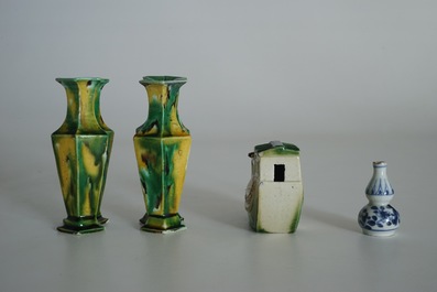 A pair of spinach and egg lozenge-shaped vases, a verte biscuit model of a boat and a miniature vase, Kangxi