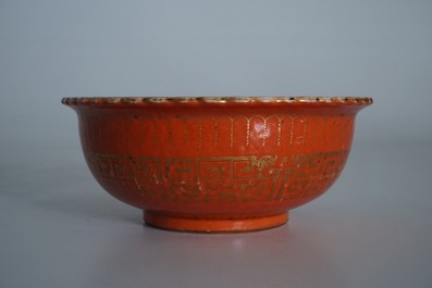 A Chinese coral-glazed and gilt bowl, Daoguang mark, 19th C.