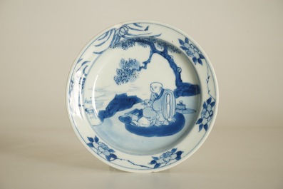 A small Chinese blue and white plate with a monk near the water, Transitional period