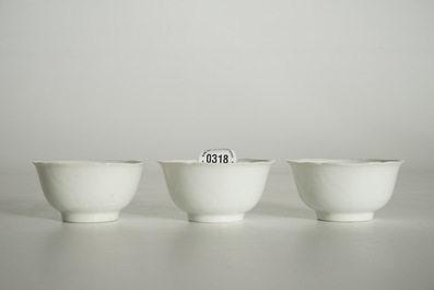 Three blanc de Chine cups and saucers with floral anhua design, Yongzheng/Qianlong