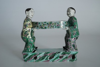 A Chinese verte biscuit group of the Hehe Er Xian brothers holding a tray, 19th C.