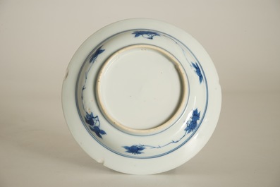 A small Chinese blue and white plate with a monk near the water, Transitional period