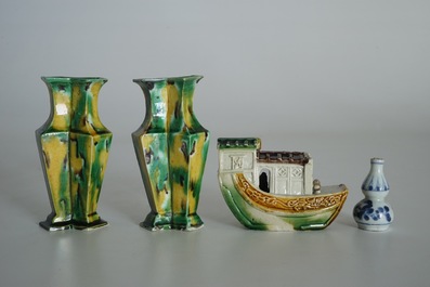 A pair of spinach and egg lozenge-shaped vases, a verte biscuit model of a boat and a miniature vase, Kangxi