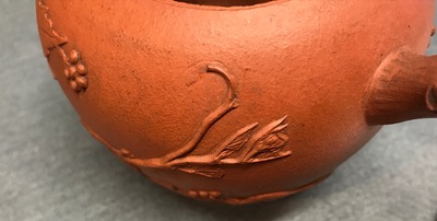 A Chinese Yixing teapot with applied vines, Kangxi