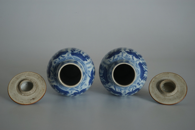 A pair of Chinese blue and white vases and covers with grapes, Kangxi