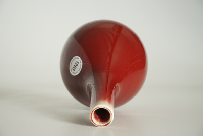 A Chinese monochrome red bottle vase, 19/20th C.
