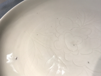 A Chinese Dehua blanc de Chine dish with incised floral design, Kangxi