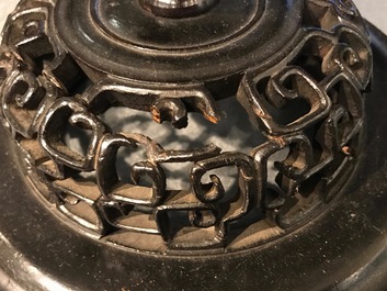 A pair of Chinese wucai baluster vases with carved lids and bases, 19th C.