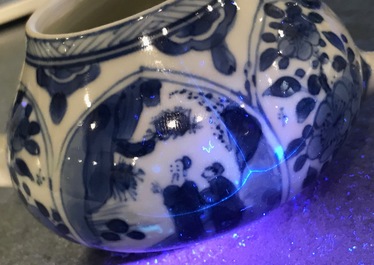 A Chinese blue and white teapot with figurative and floral panels, Kangxi