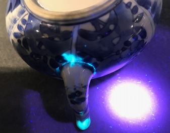 A Chinese blue and white teapot with figurative and floral panels, Kangxi