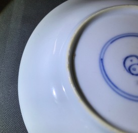 A Chinese famille verte cup and saucer with yin-yang mark, Kangxi