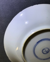 A Chinese famille verte cup and saucer with yin-yang mark, Kangxi