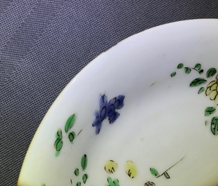 A Chinese famille verte cup and saucer with yin-yang mark, Kangxi