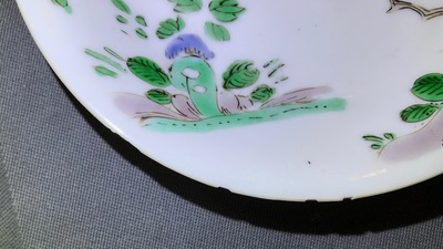 A Chinese famille verte cup and saucer with yin-yang mark, Kangxi