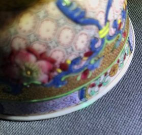 A Chinese famille rose cup and saucer with a cat, Yongzheng