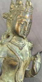 Een Chinese bronzen wierookbrander met Xuande merk, een bronzen Tara en een verguld koperen votiefbeeldje, Ming en later