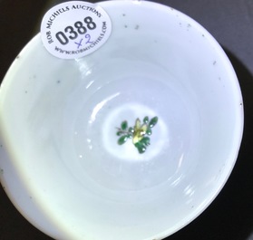 A Chinese famille verte cup and saucer with yin-yang mark, Kangxi