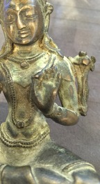 A Chinese Xuande mark bronze censer, a bronze model of Tara and a gilt copper alloy figure, Ming and later