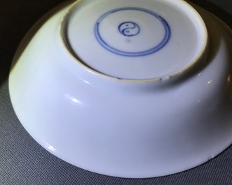 A Chinese famille verte cup and saucer with yin-yang mark, Kangxi