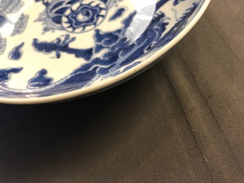 A pair of Chinese blue and white plates with dragon and qilin design, Yongzheng mark and period