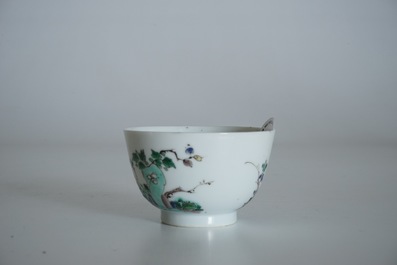 A Chinese famille verte cup and saucer with yin-yang mark, Kangxi