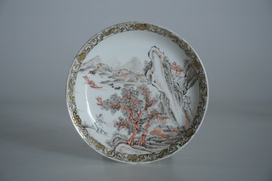 Une tasse et soucoupe en porcelaine de Chine &agrave; d&eacute;cor d'un paysage, Yongzheng